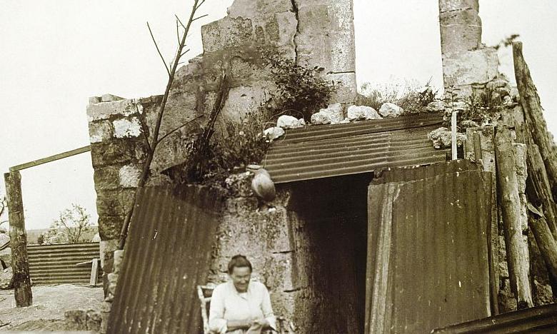  Mother &amp; child in front of their destroyed home - WWI
