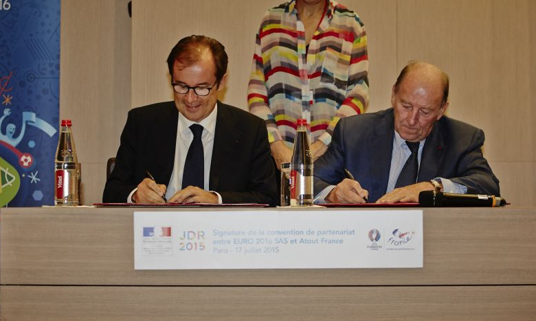 Christian Mantei of Atout France and Jacques Lambert of the UEFA signing agreement